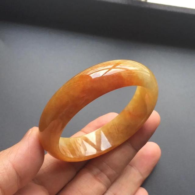 木那翡翠原石翡翠原石满黄翡开窗后肉质发黑-第8张图片-翡翠网 木那翡翠原石翡翠原石满黄翡开窗后肉质发黑-第8张图片-翡翠网